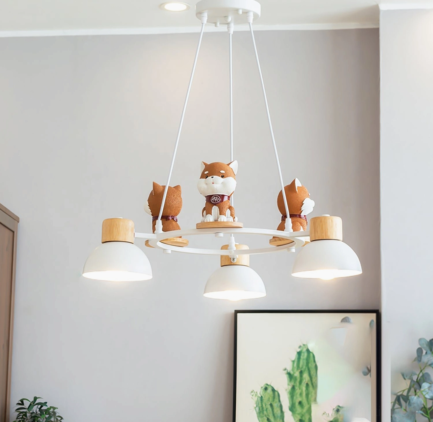 3-head Shiba Inu pendant chandelier in living room with cactus wall painting and warm Nordic ambiance