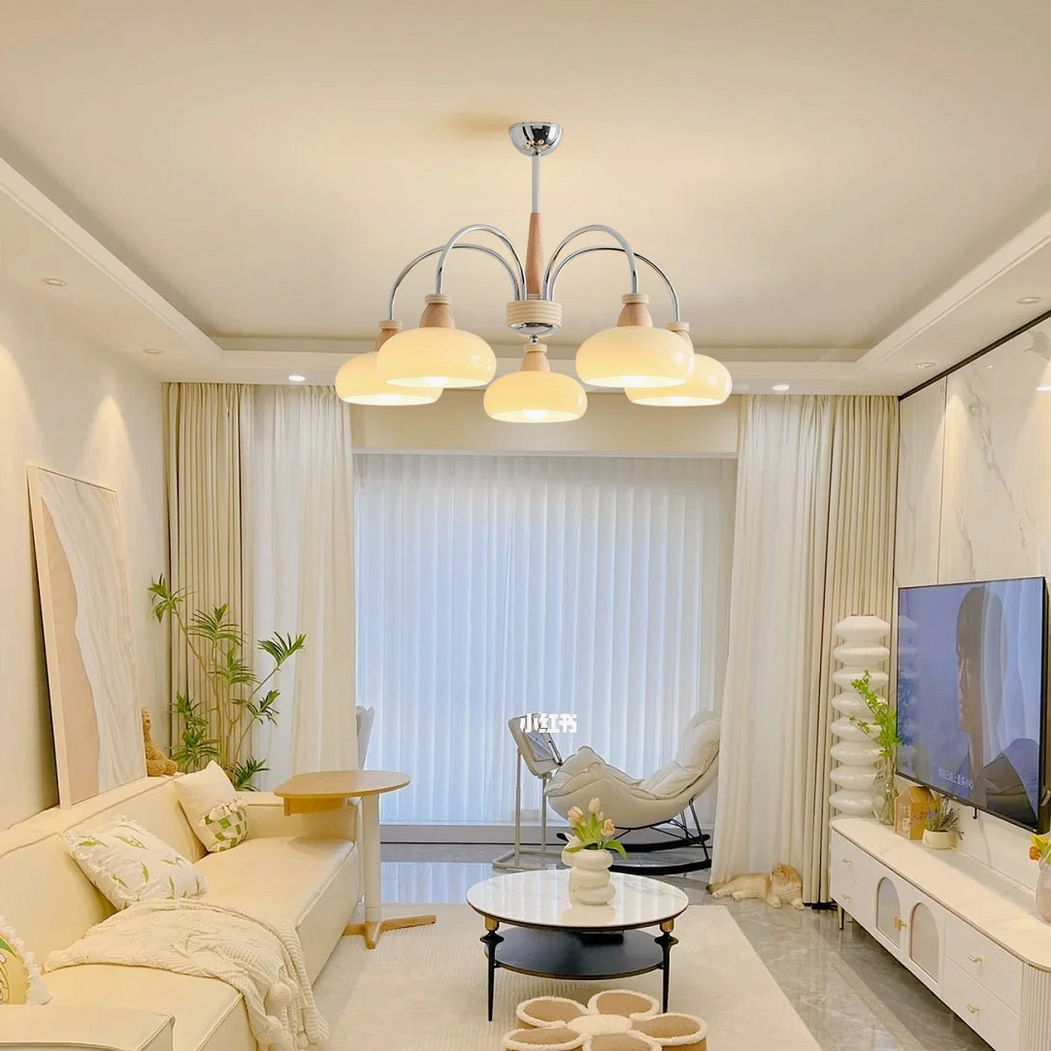 5-head pendant chandelier in neutral warm home decor living room with tv lounge seating