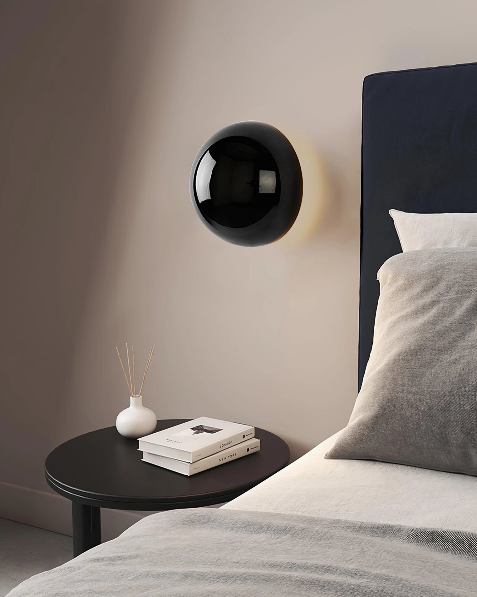Adjustable hemisphere sconce with pull mechanism creating expandable light halo