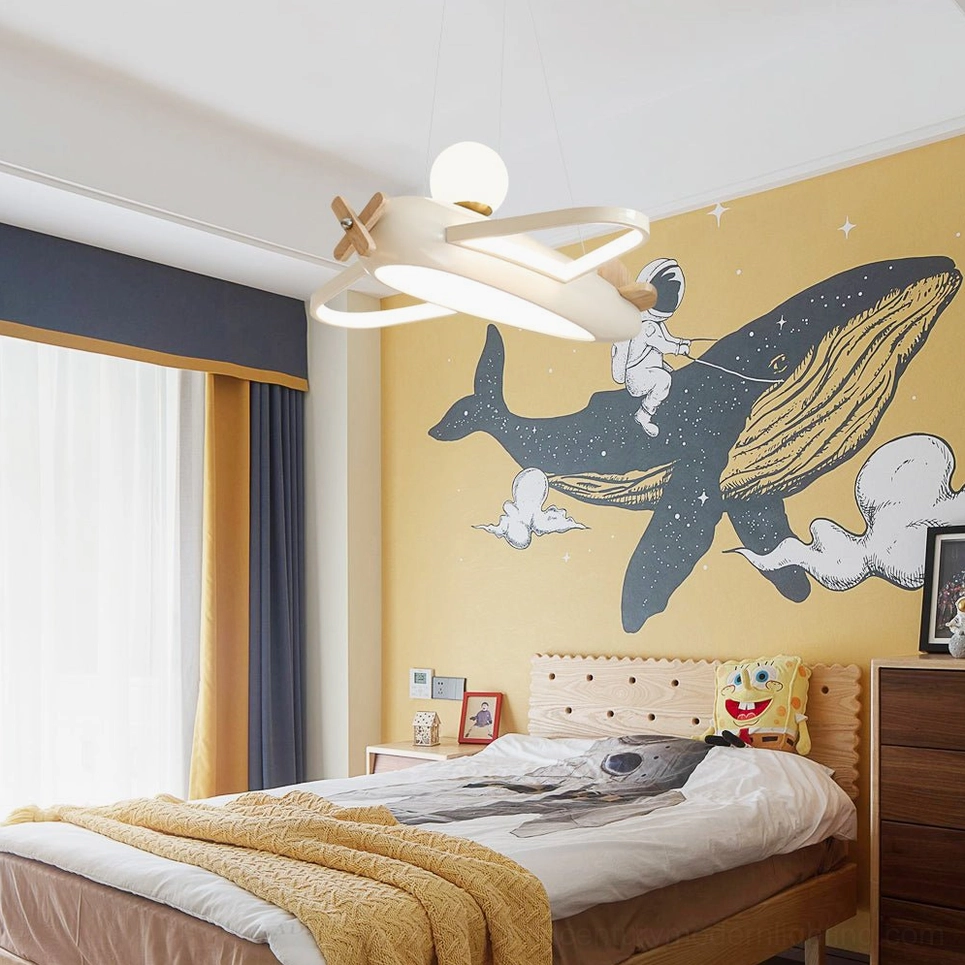 Aircraft pendant lamp above bed in kids bedroom with whale wall mural nautical theme