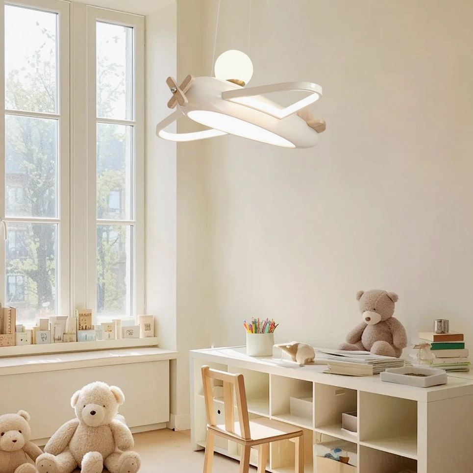Aircraft pendant lamp installed in kids study room near window with nautical decor
