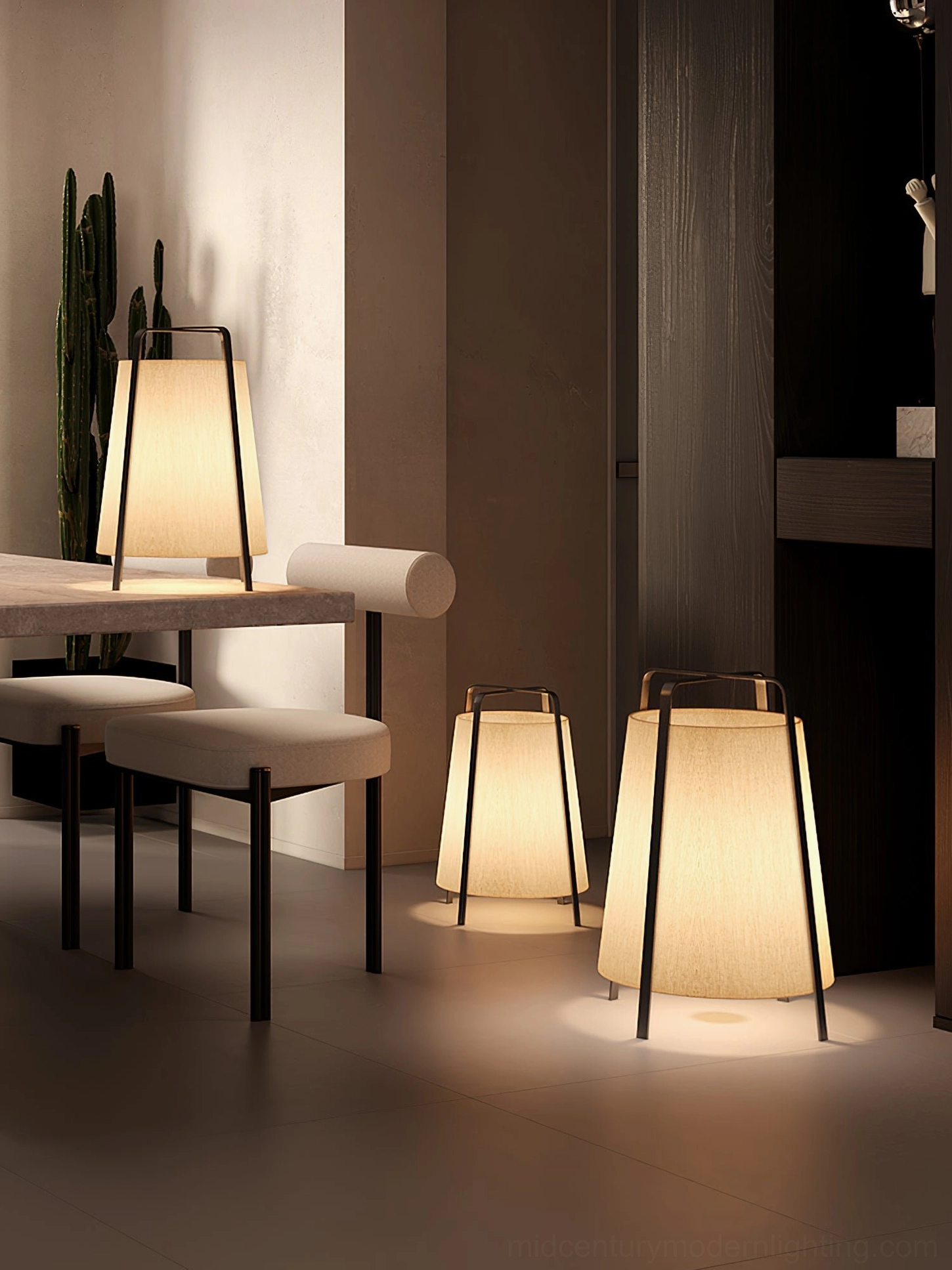 Akane table lamp illuminated in moody atmospheric interior design scene with warm ambient glow