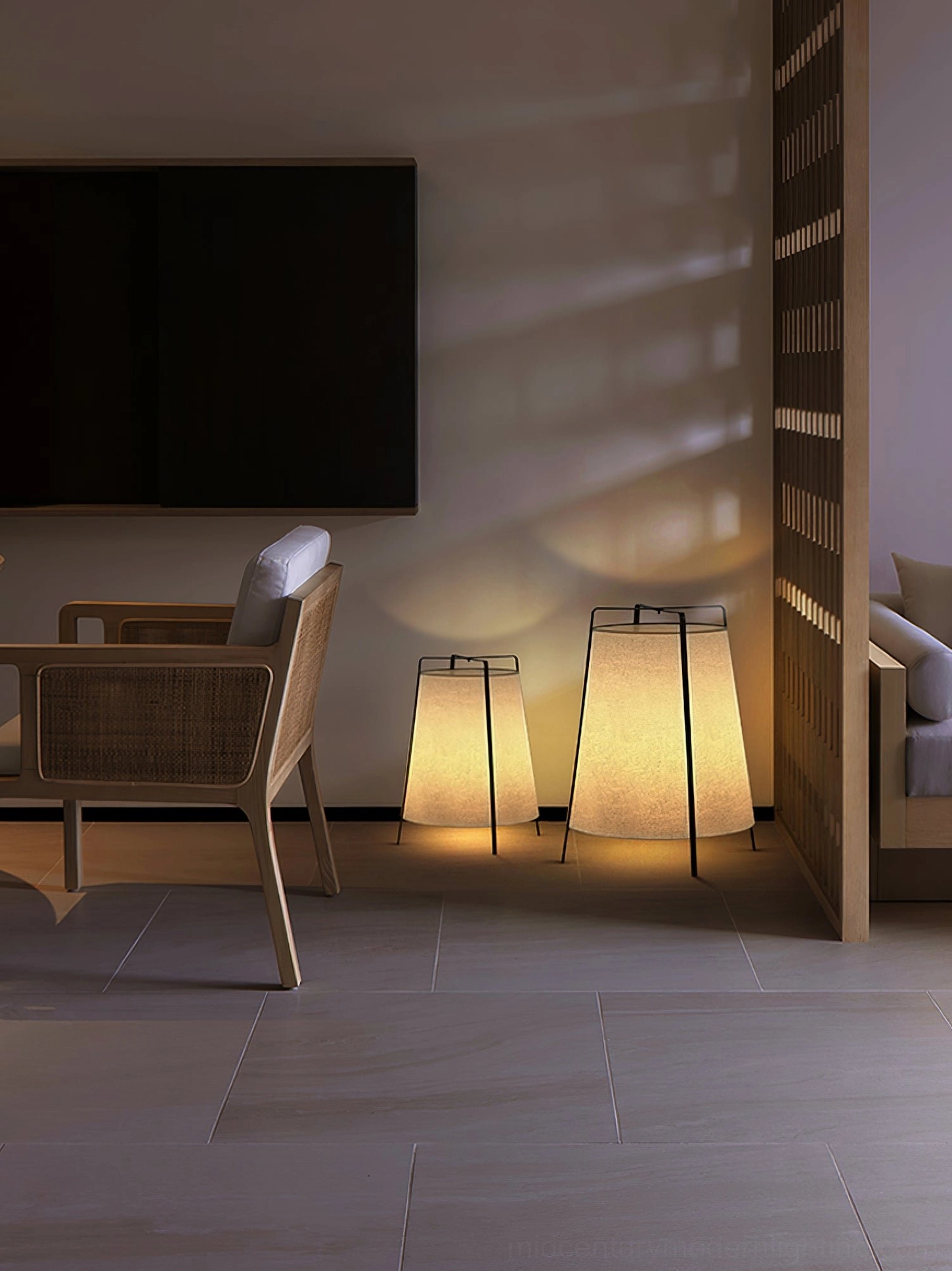 Akane table lamp showing 360-degree ambient light diffusion through fabric shade in dark room