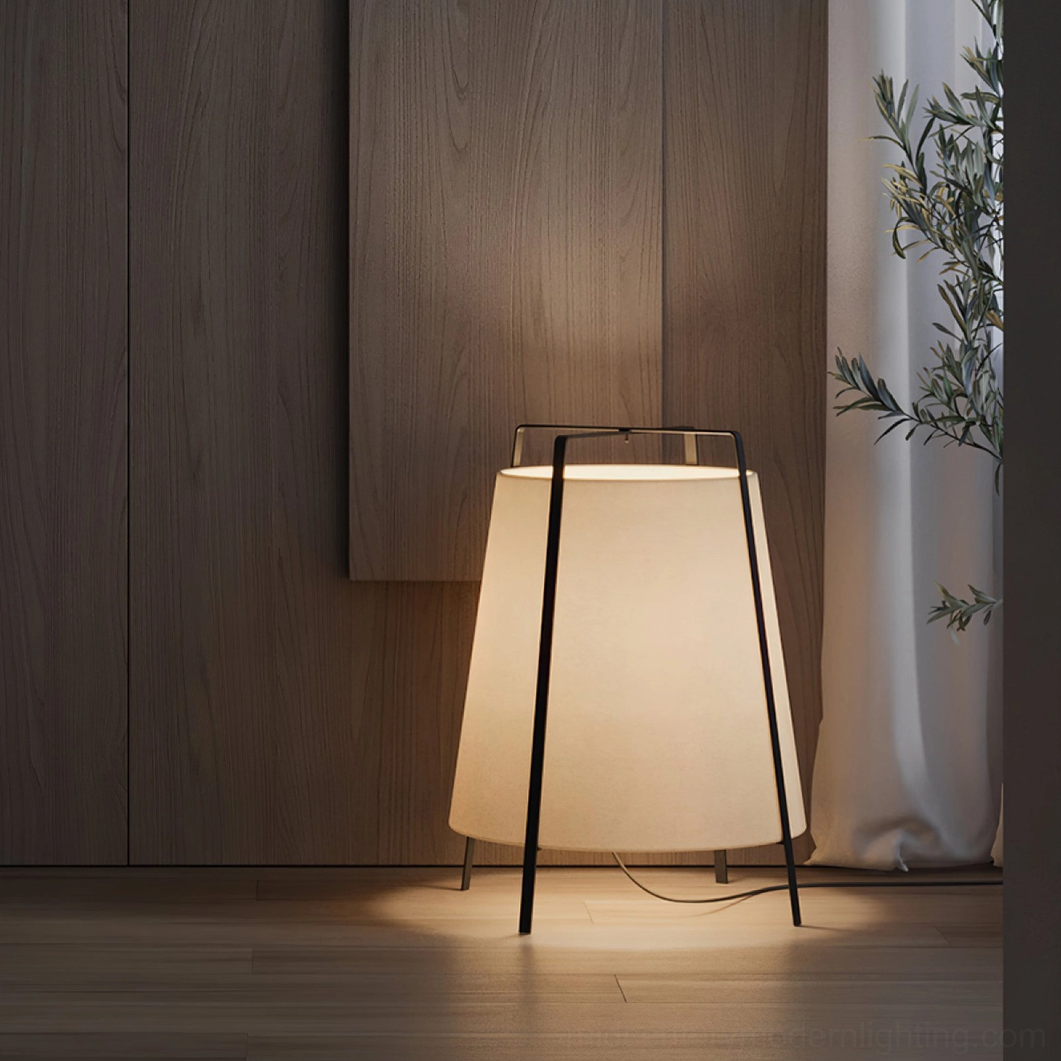 Akane table lamp demonstrating size scale with light brown fabric shade and black metal frame