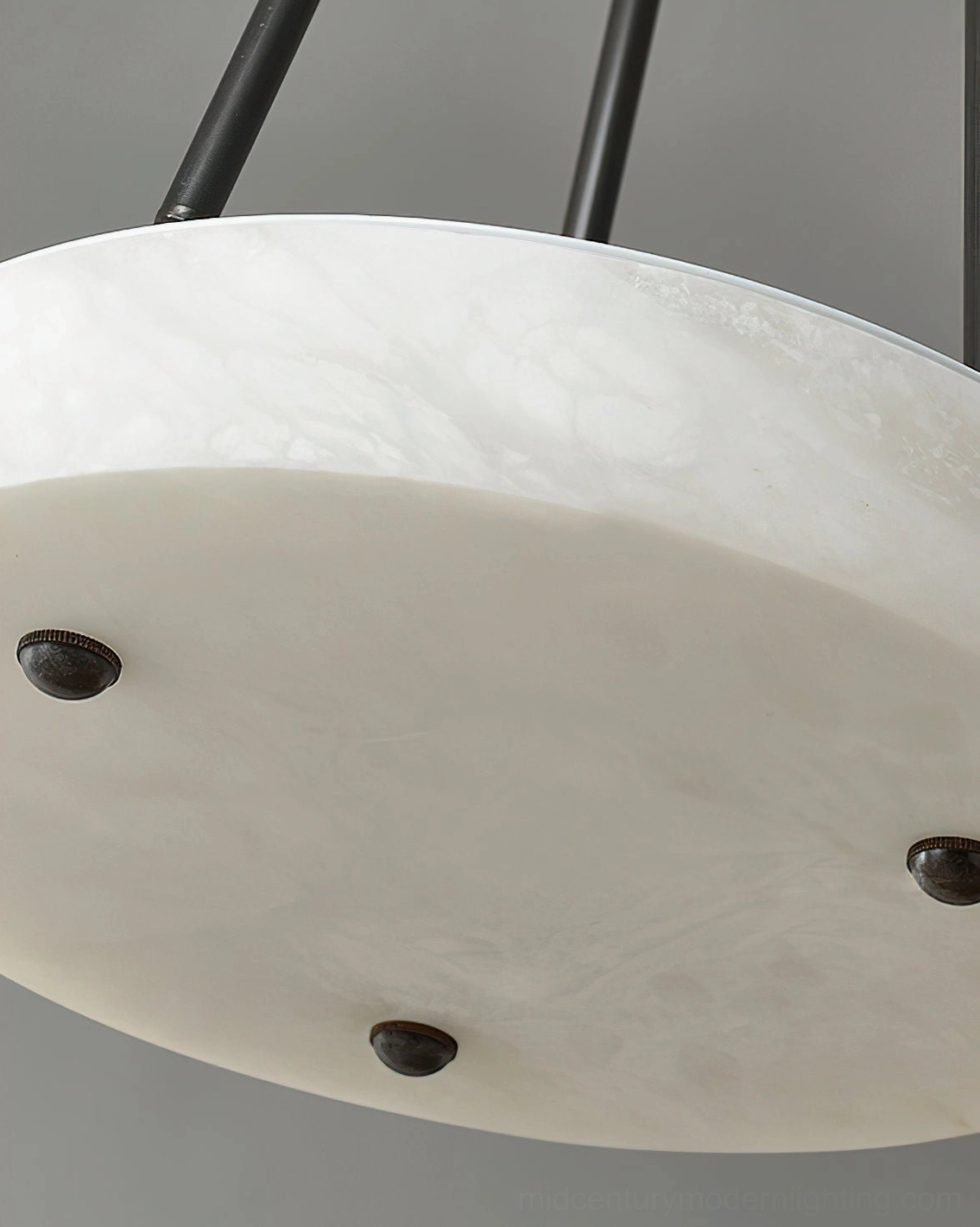 Complete alabaster tripod pendant lamp lit showing warm illumination through translucent stone