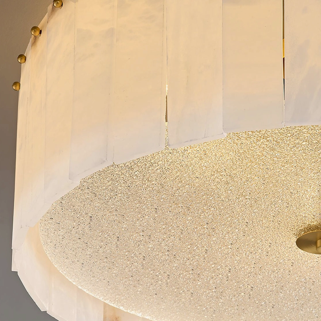 Close-up of frosted alabaster diffuser with slatted cover and brass frame details