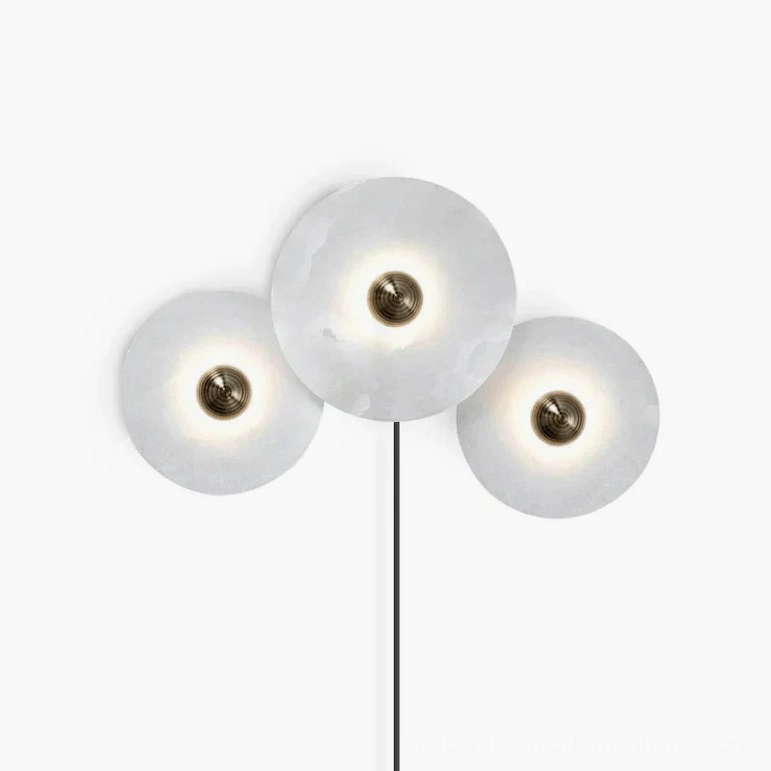 Three identical equal-sized alabaster discs wall lamp with bronze details, centered front view