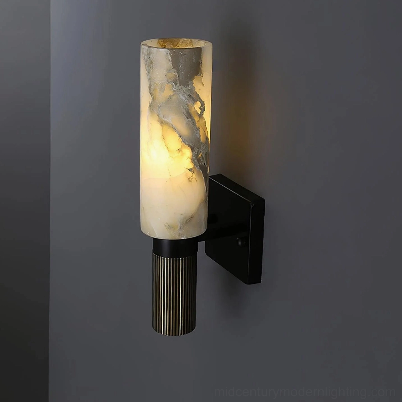 Alabaster wall lamp creating dramatic lighting effect in contemporary styled interior space