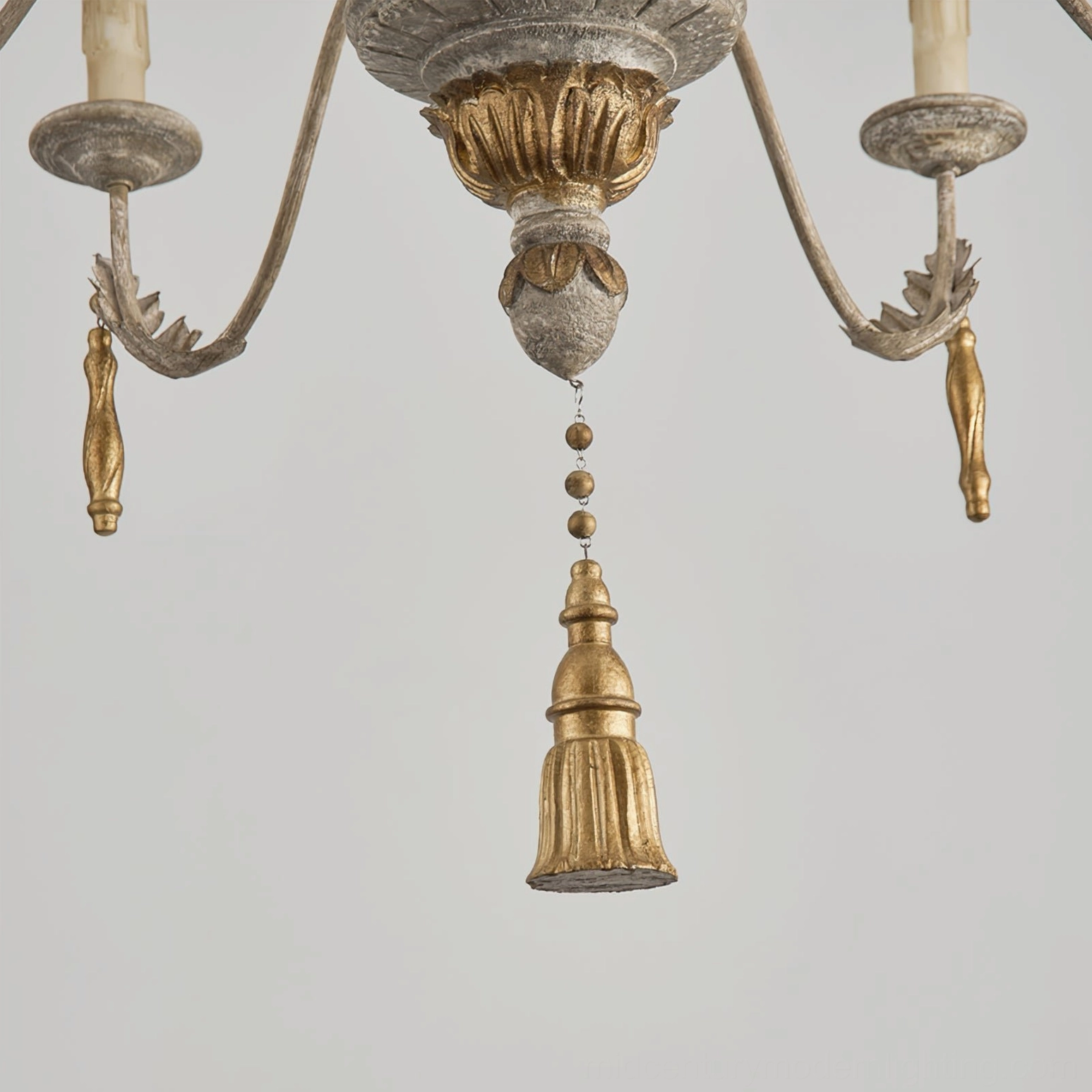 Alda chandelier top detail showing gold-gilded carved center medallion and bead chain suspension