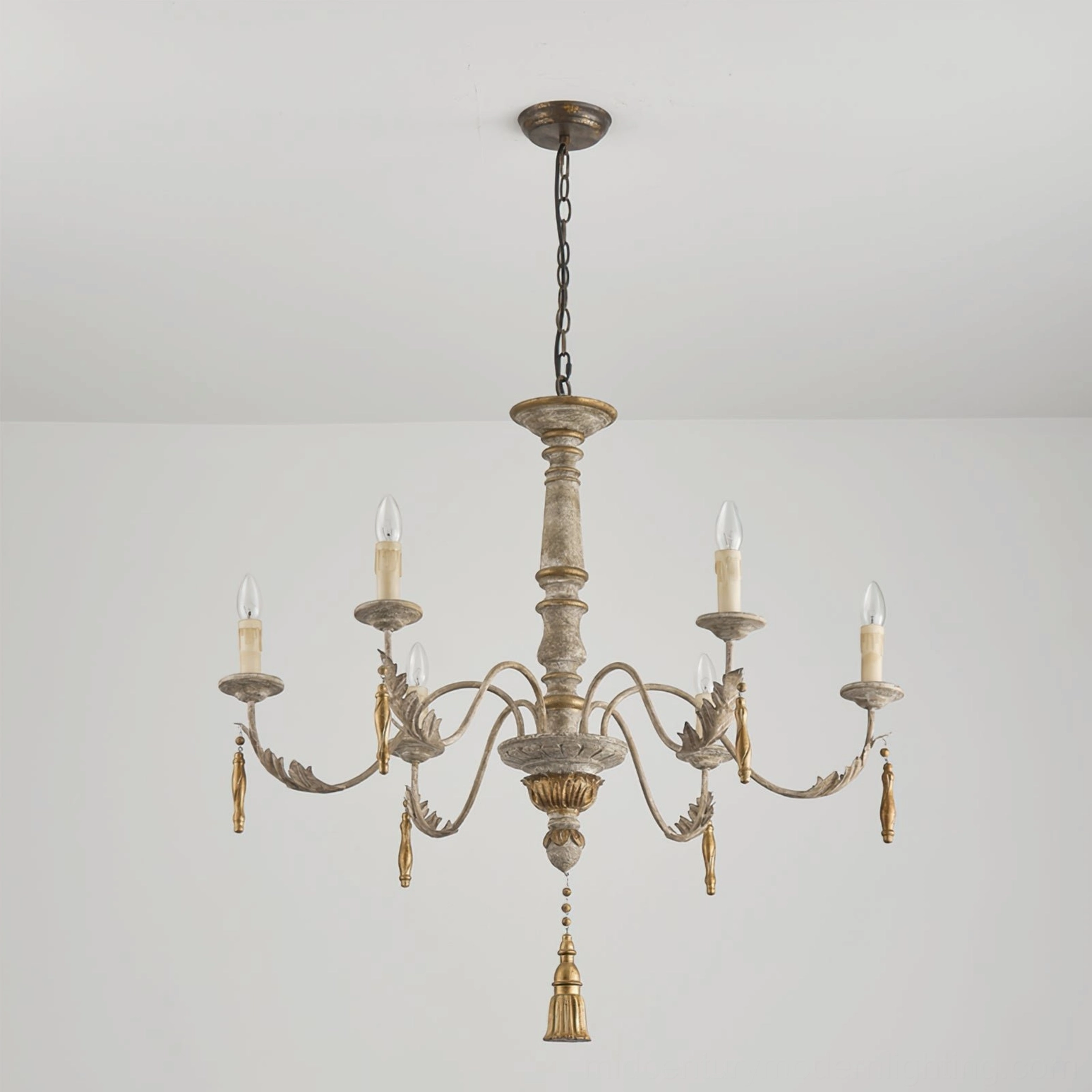 Alda chandelier fully illuminated in minimalist room setting, low-angle lighting view