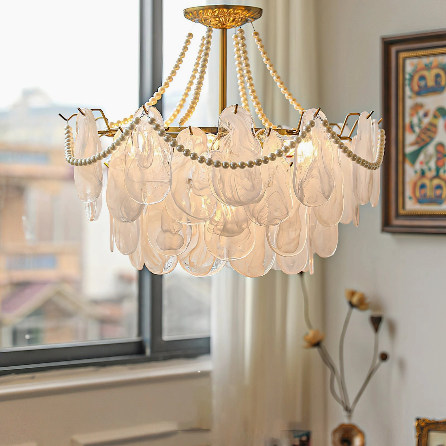 Modern petal glass chandelier three-quarter view in residential living room with ambient lighting
