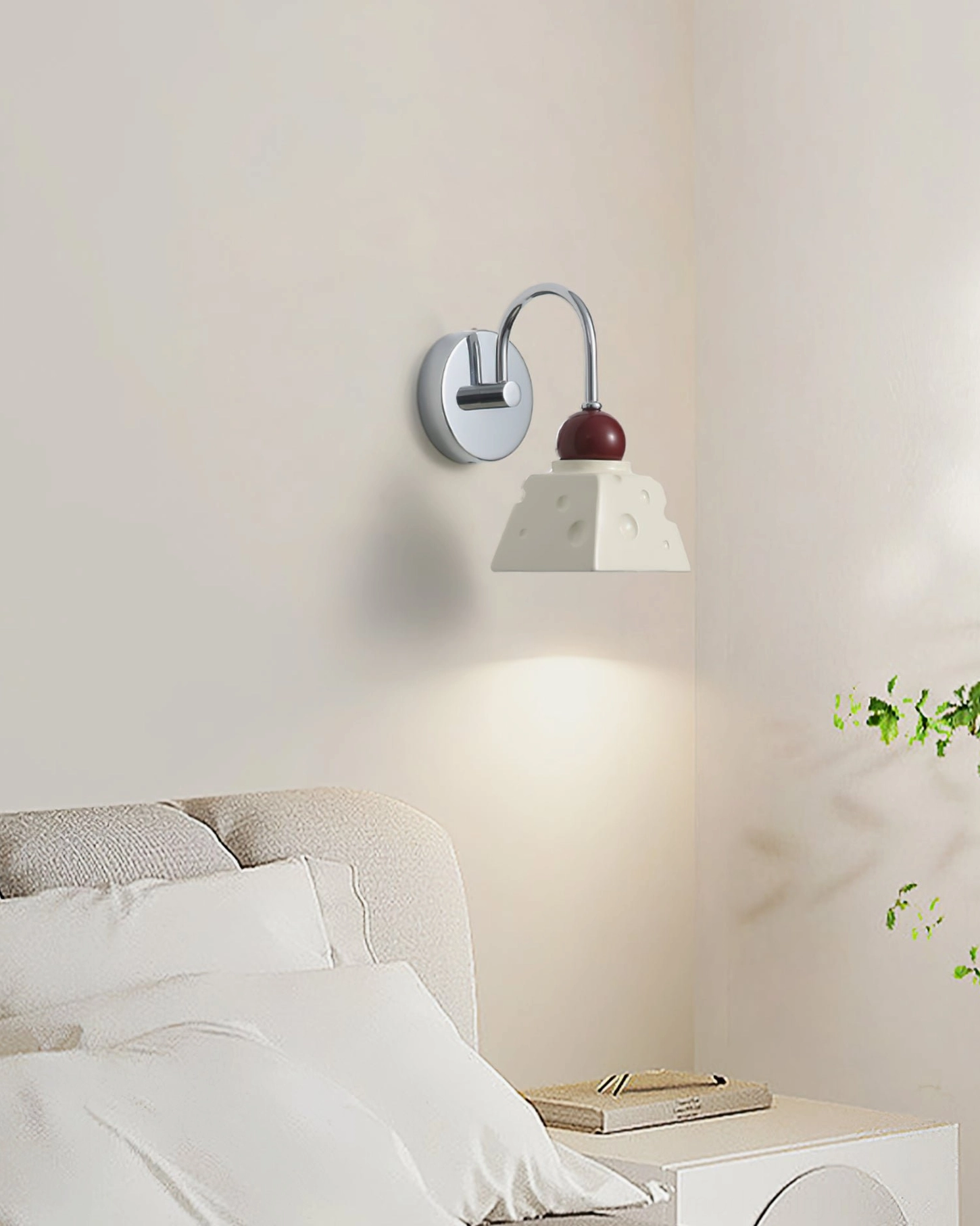 Alma bedroom bedside wall sconce providing warm ambient lighting in modern bedroom setting