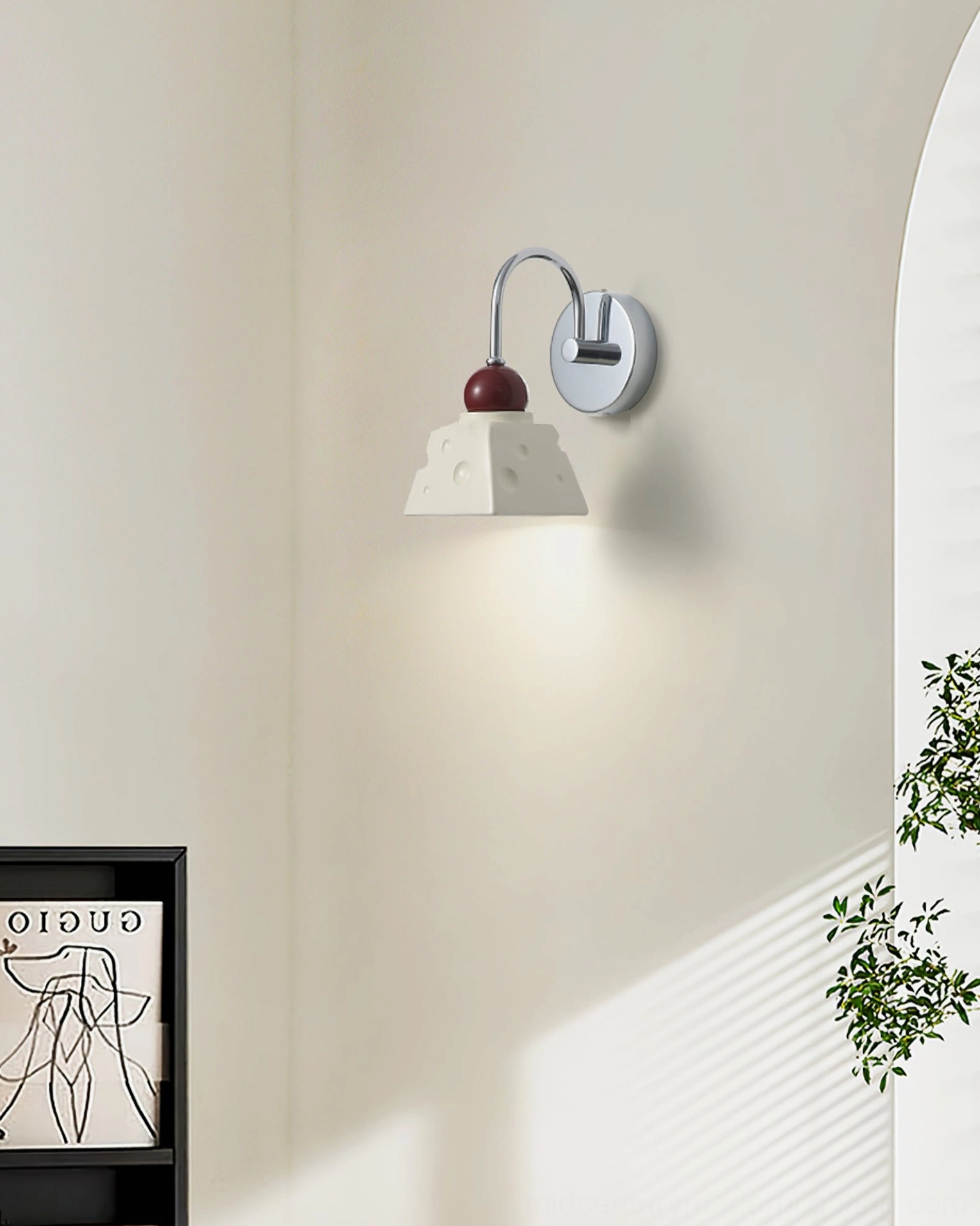 Alma cream wall light in minimalist hallway passage with green plants and gallery wall art