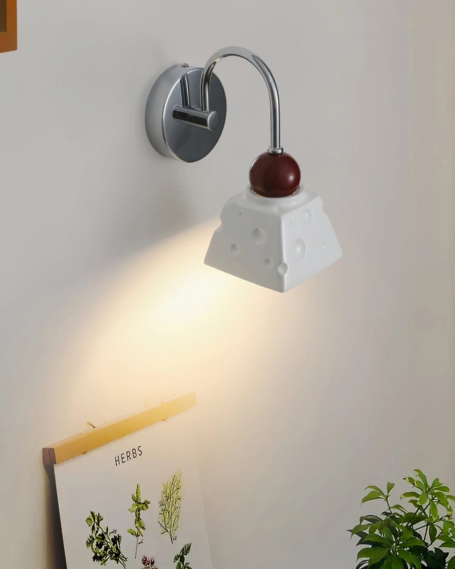 Alma wall light red finish, contemporary interior accent piece on neutral wall
