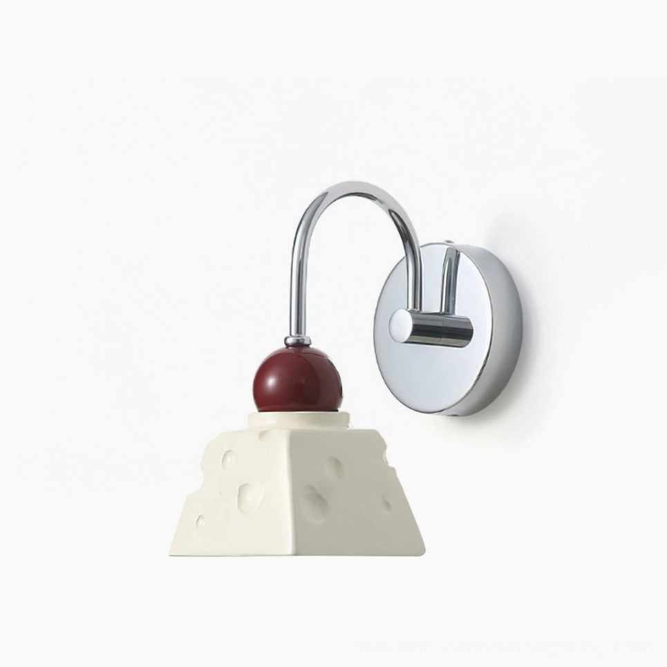 Alma modern wall sconce in chrome and red finish, front view showing sculptural resin diffuser design