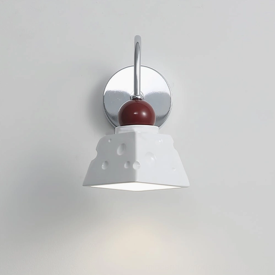 Alma LED wall sconce pure white finish, low angle view with warm glow illumination
