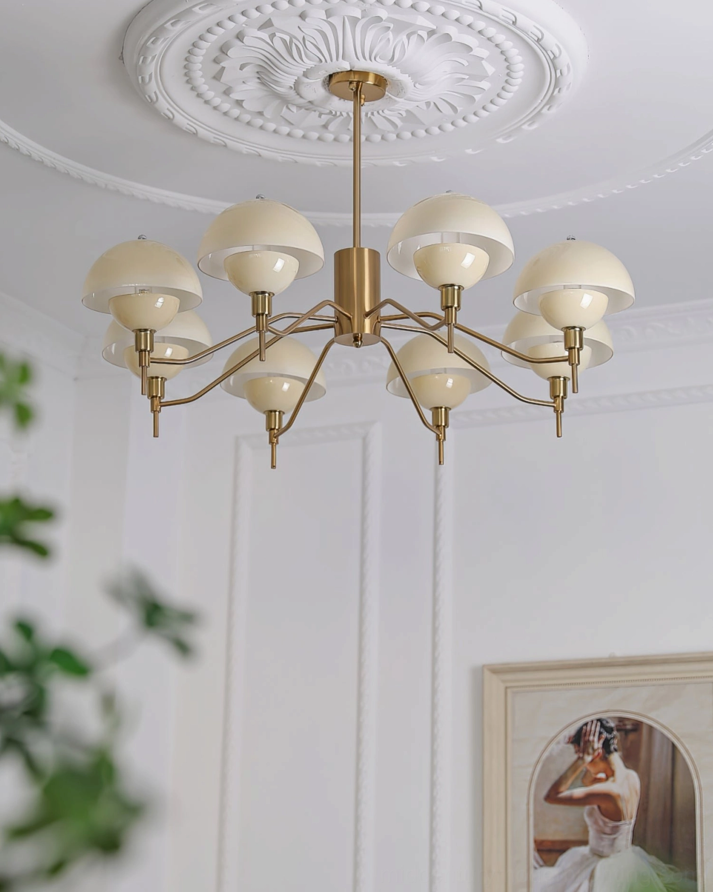 Multi-arm ceiling chandelier angled view elegant residential living room brass finish