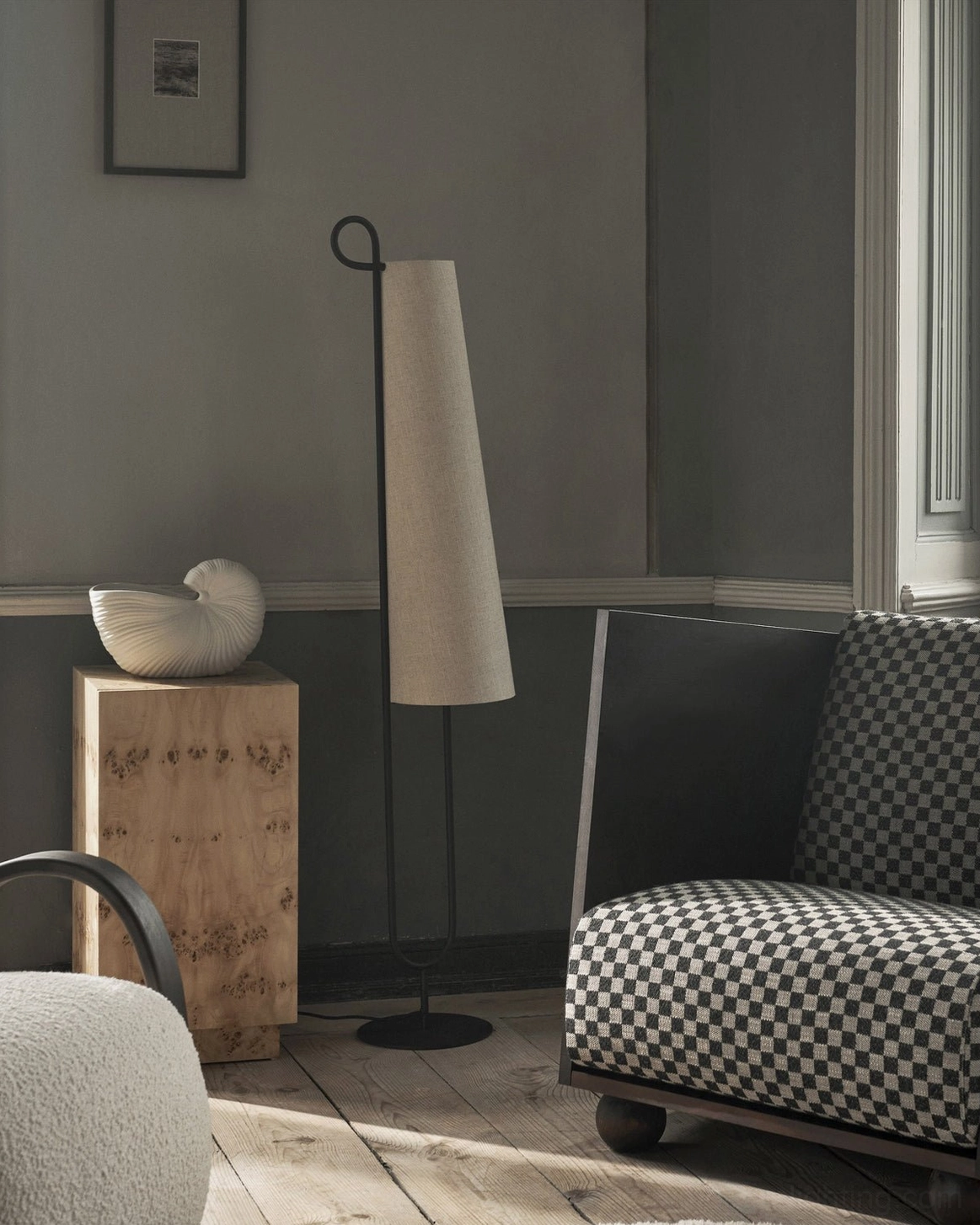 Ancora minimalist floor lamp detail shot showing black metal frame loop design and linen fabric shade construction