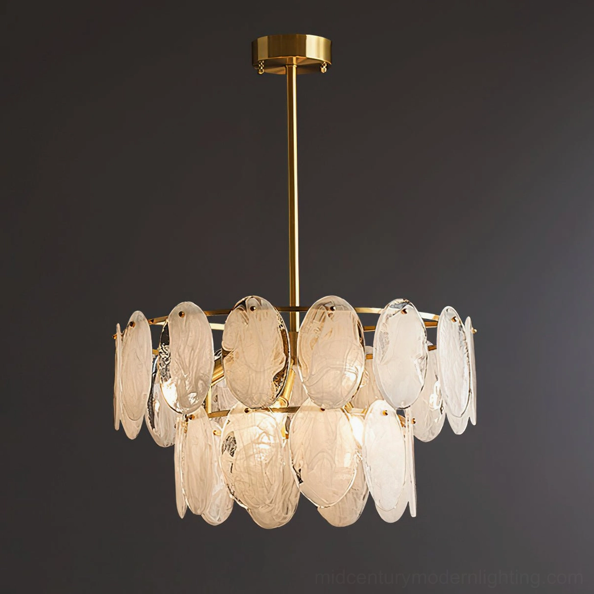 Compact tiered glass chandelier low-angle front view warm amber glass petals brass framework