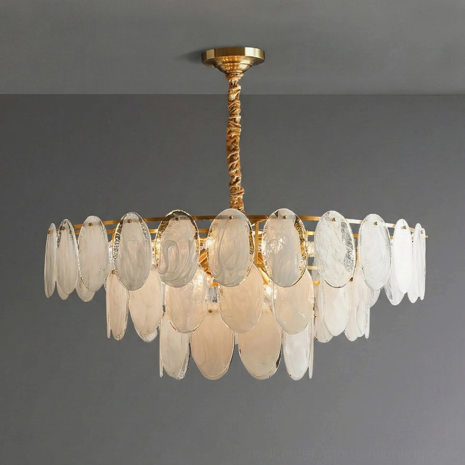 Glass petal chandelier side front view gray wall white frosted glass shades twisted brass rod