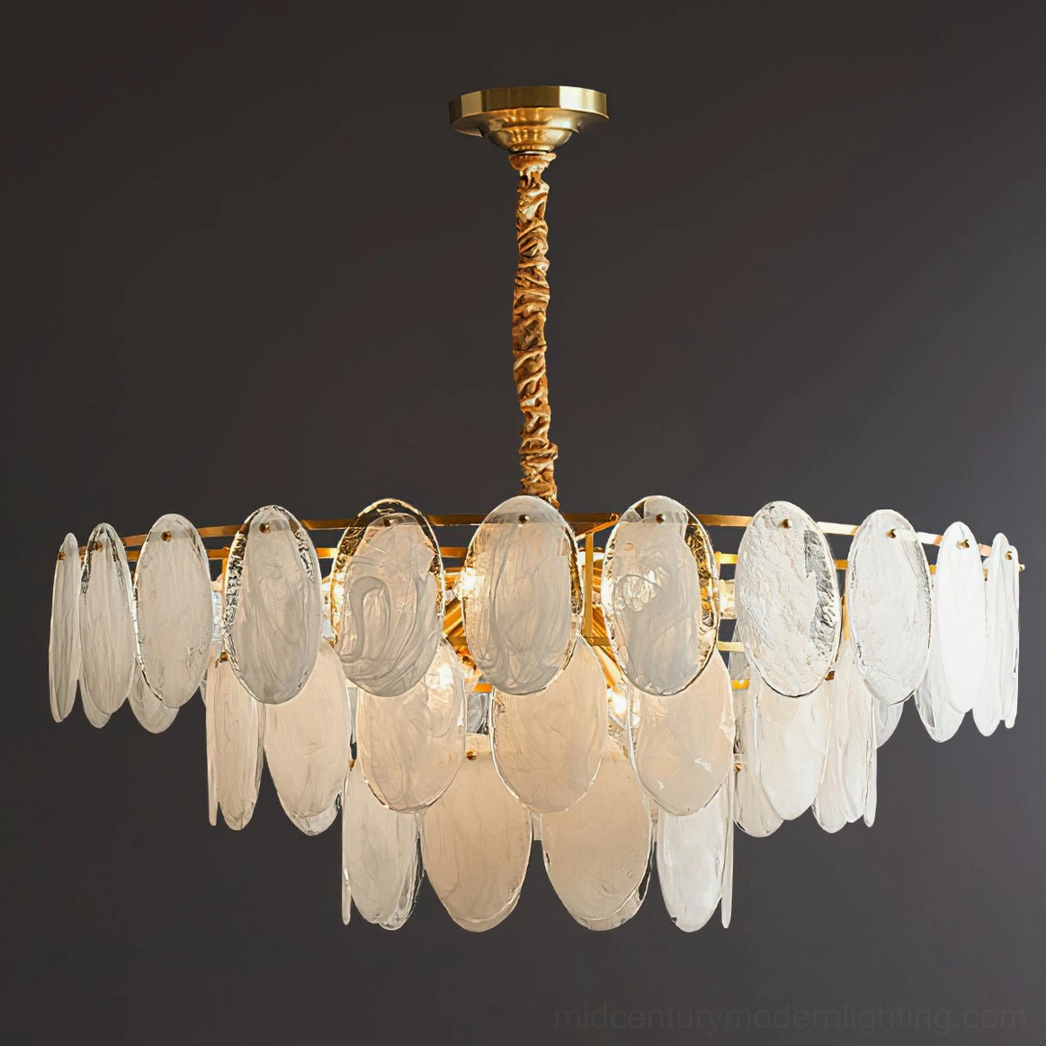 Large tiered glass chandelier dual-row oval shades polished brass hardware dark studio background