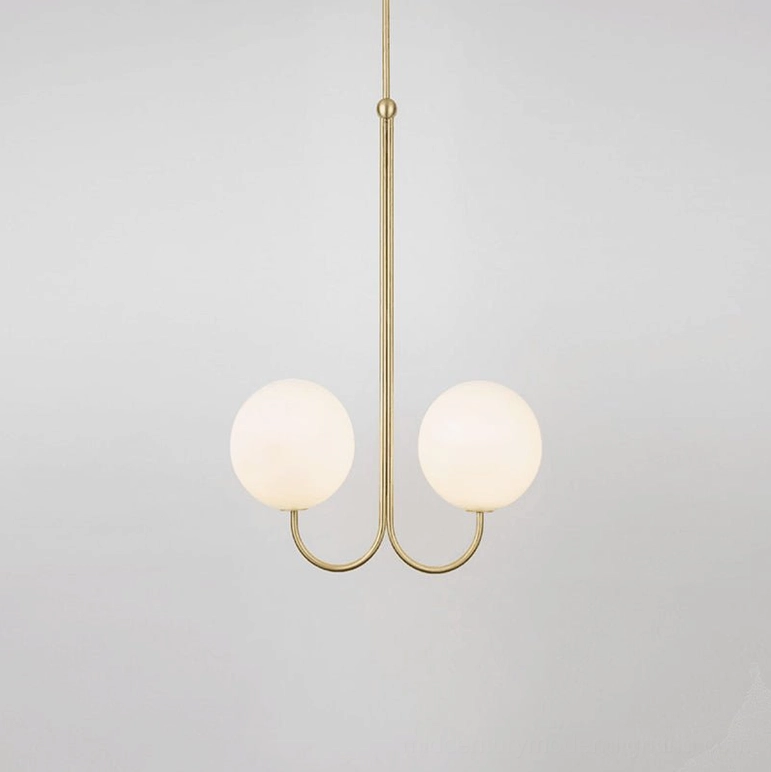 2-head angle chandelier with dual frosted glass globes and curved brass frame suspended from ceiling