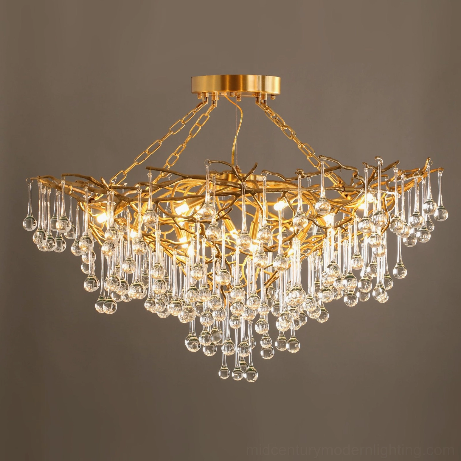 Close-up of Anita brass chandelier with polished gold finish and crystal pendants, luxury detail shot