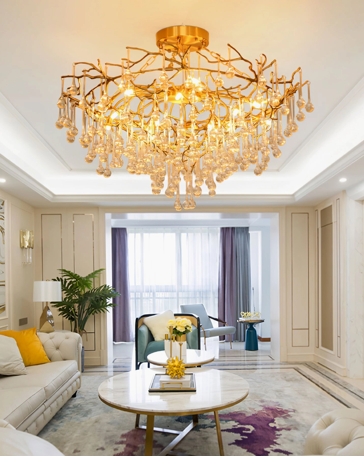 Anita gold leaf pendant chandelier in spacious modern living room, panoramic interior view