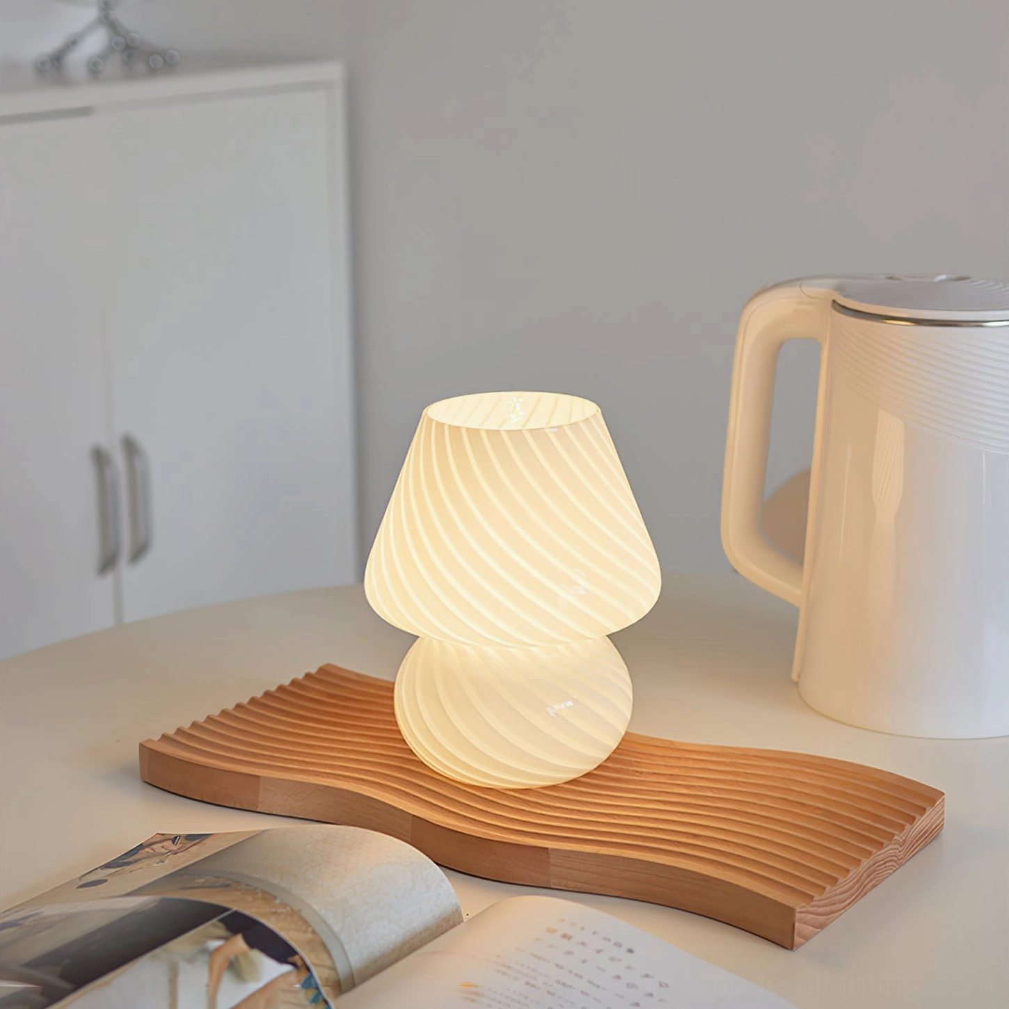 Cream white striped Ansel mushroom lamp oblique overhead view on kitchen dining table with wooden tray