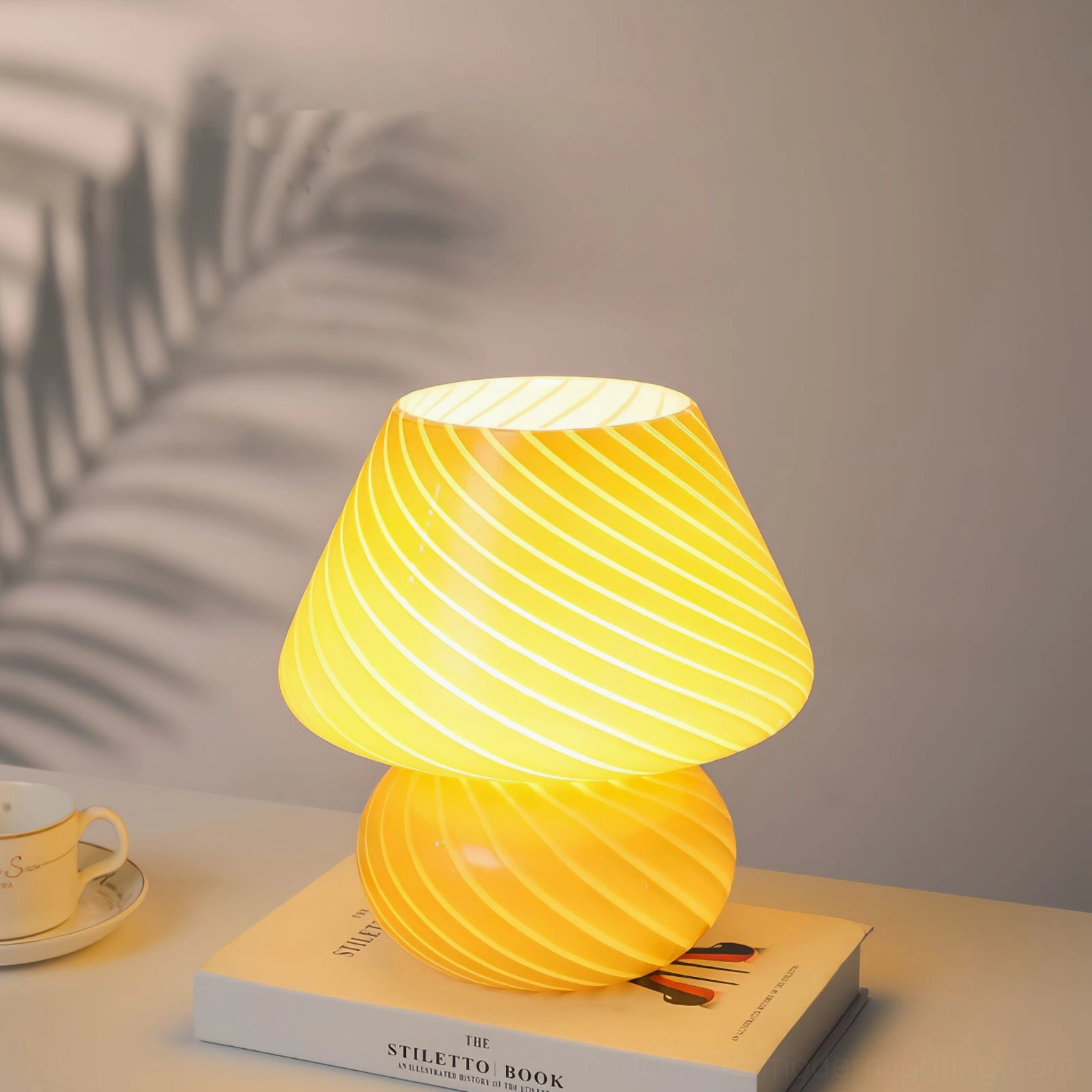Ansel sculptural glass lamp creating atmospheric lighting and shadow ambiance in room