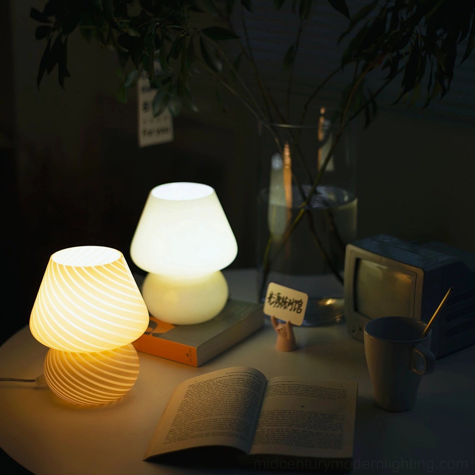 Ansel textured glass lamp showing bulbous base and open angular top design characteristic