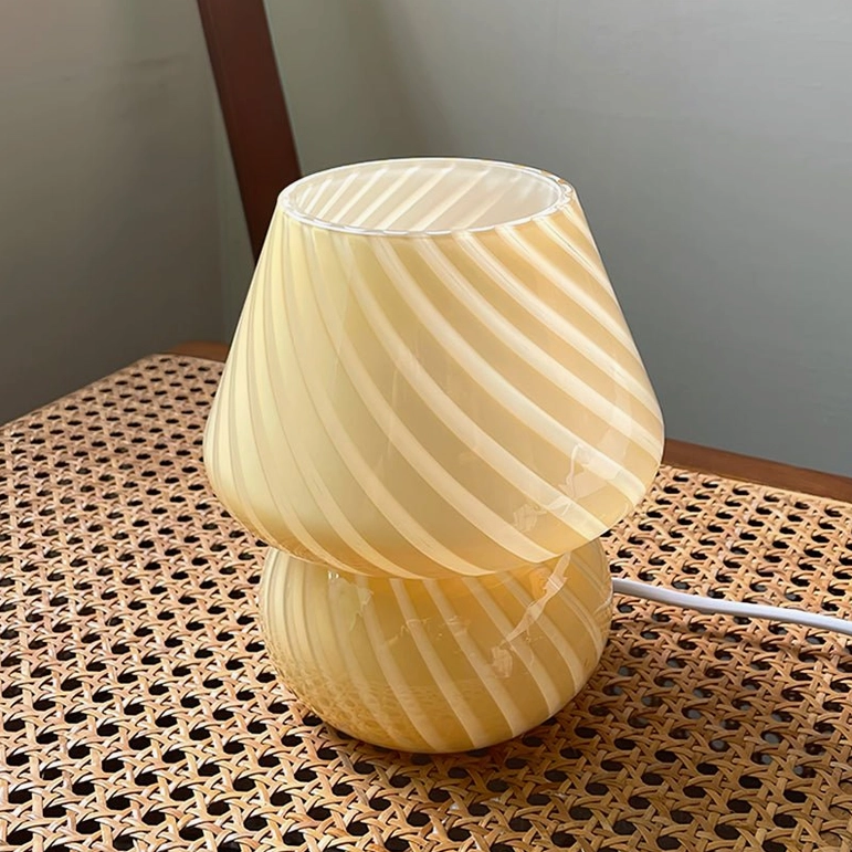 Ansel handcrafted glass lamp showing bulb socket compatibility with warm light diffusion