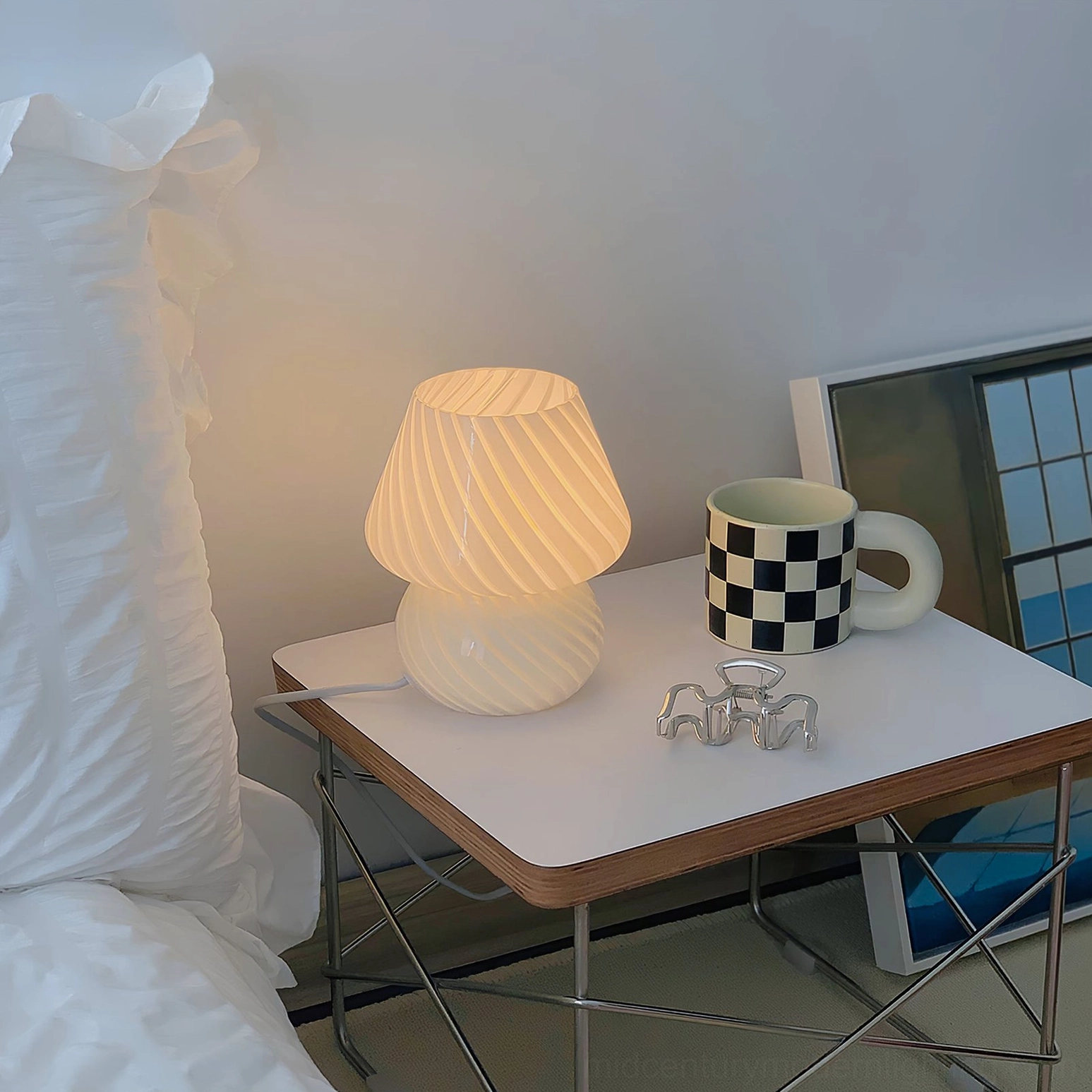 Ansel mid-century modern glass table lamp styled in minimalist home interior setting