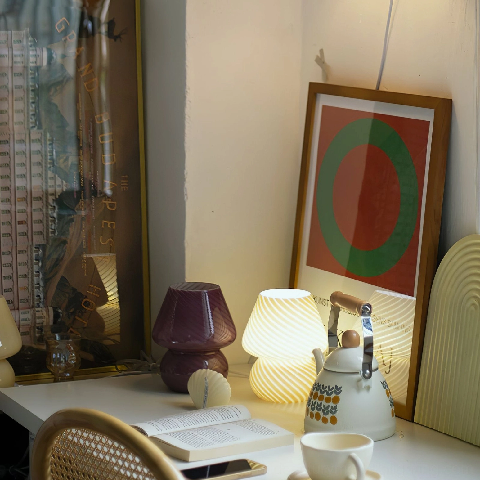 Ansel sculptural glass table lamp on wooden furniture with warm illumination and shadow effects