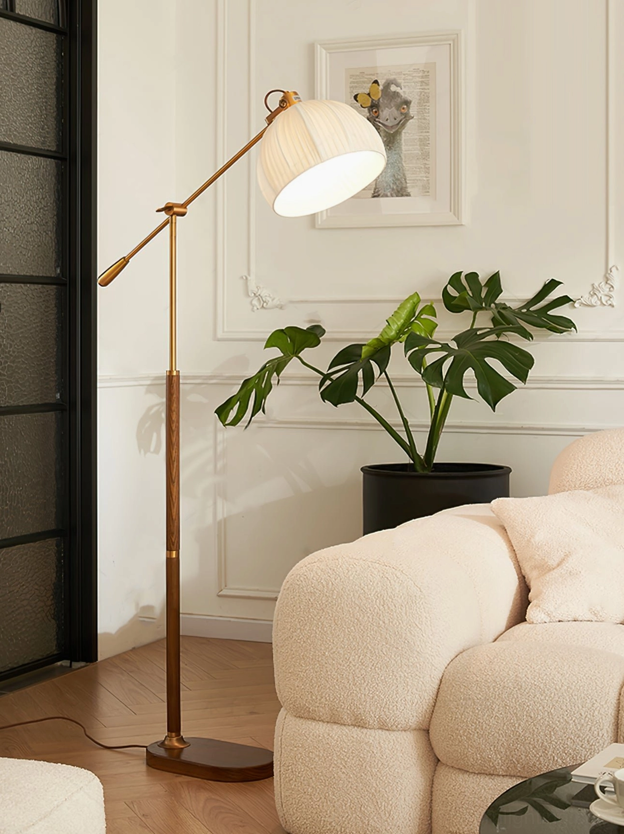 Contemporary Anthony floor lamp with silver or black metal finish and adjustable arm in modern home interior styling