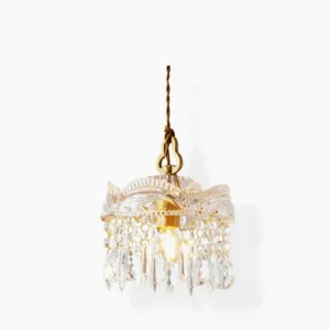Antigua crystal pendant light with brass hardware and teardrop crystals, studio front view on white background
