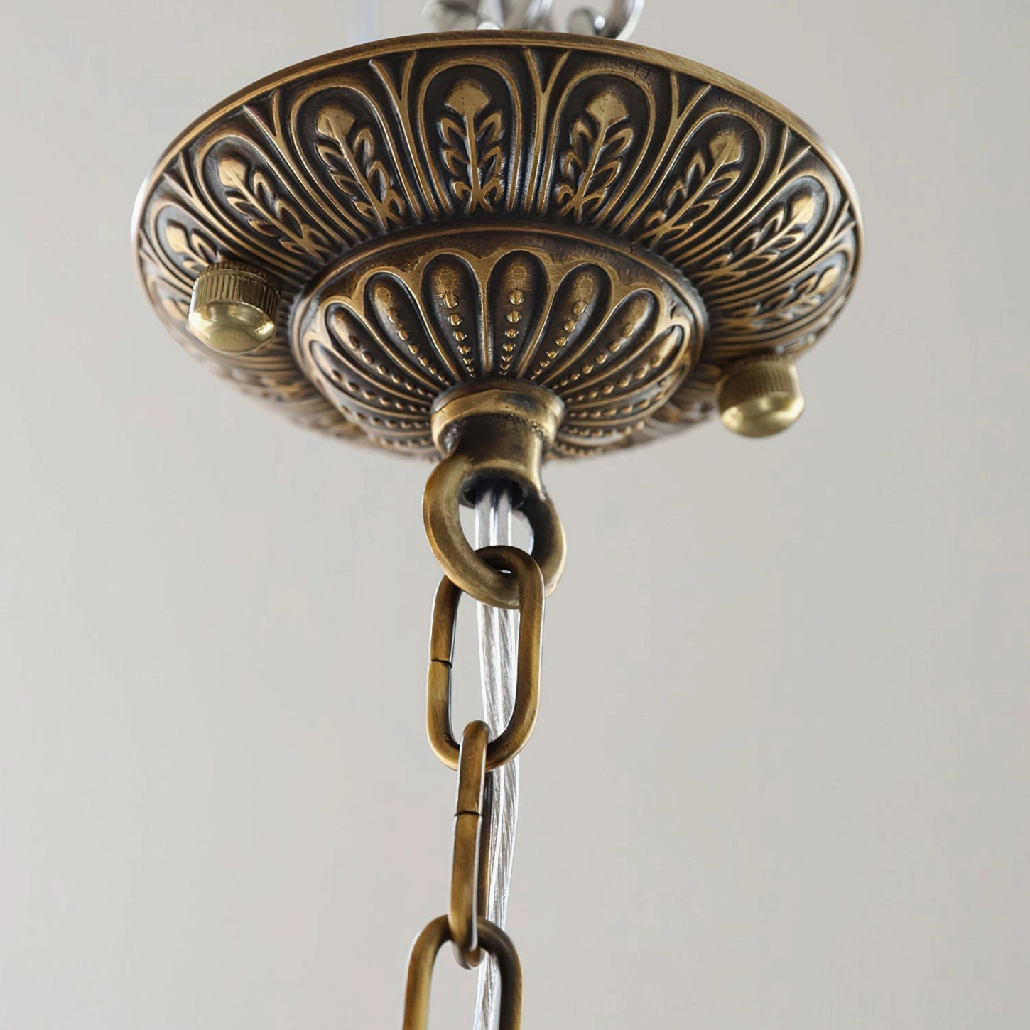 Antique birdcage crystal pendant lighting fixture with decorative brass metalwork and elegant form