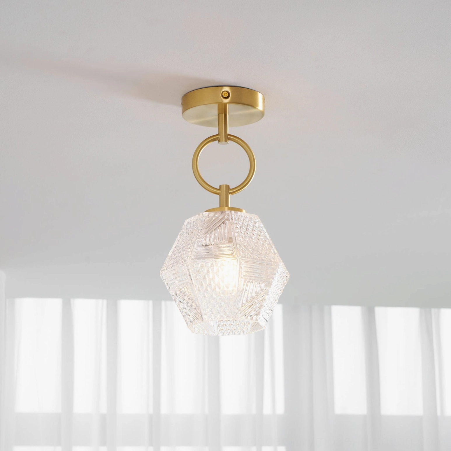 Antique brass Art Deco diamond cut pendant light with geometric faceted design