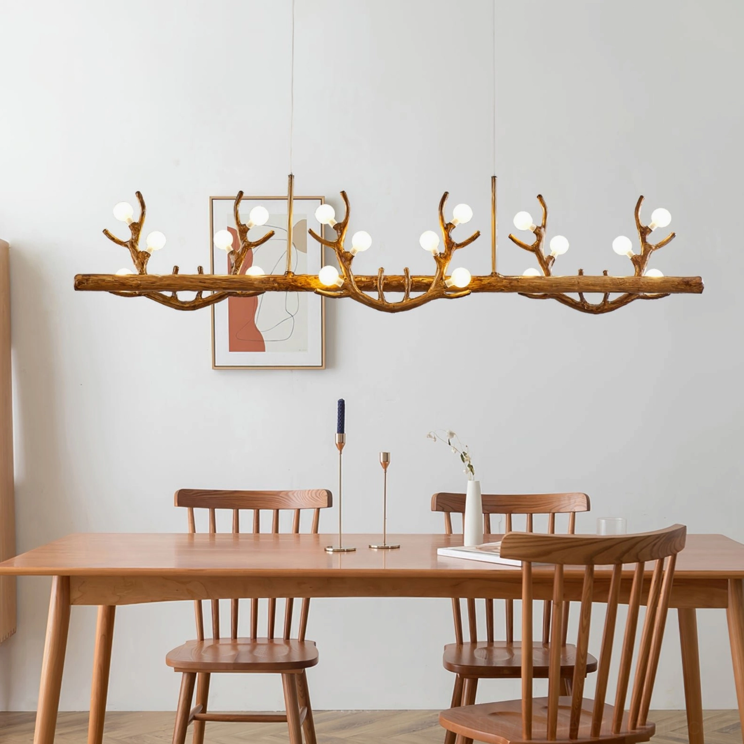 Antler branch pendant chandelier side view installed in minimalist farmhouse rustic dining room with warm lighting