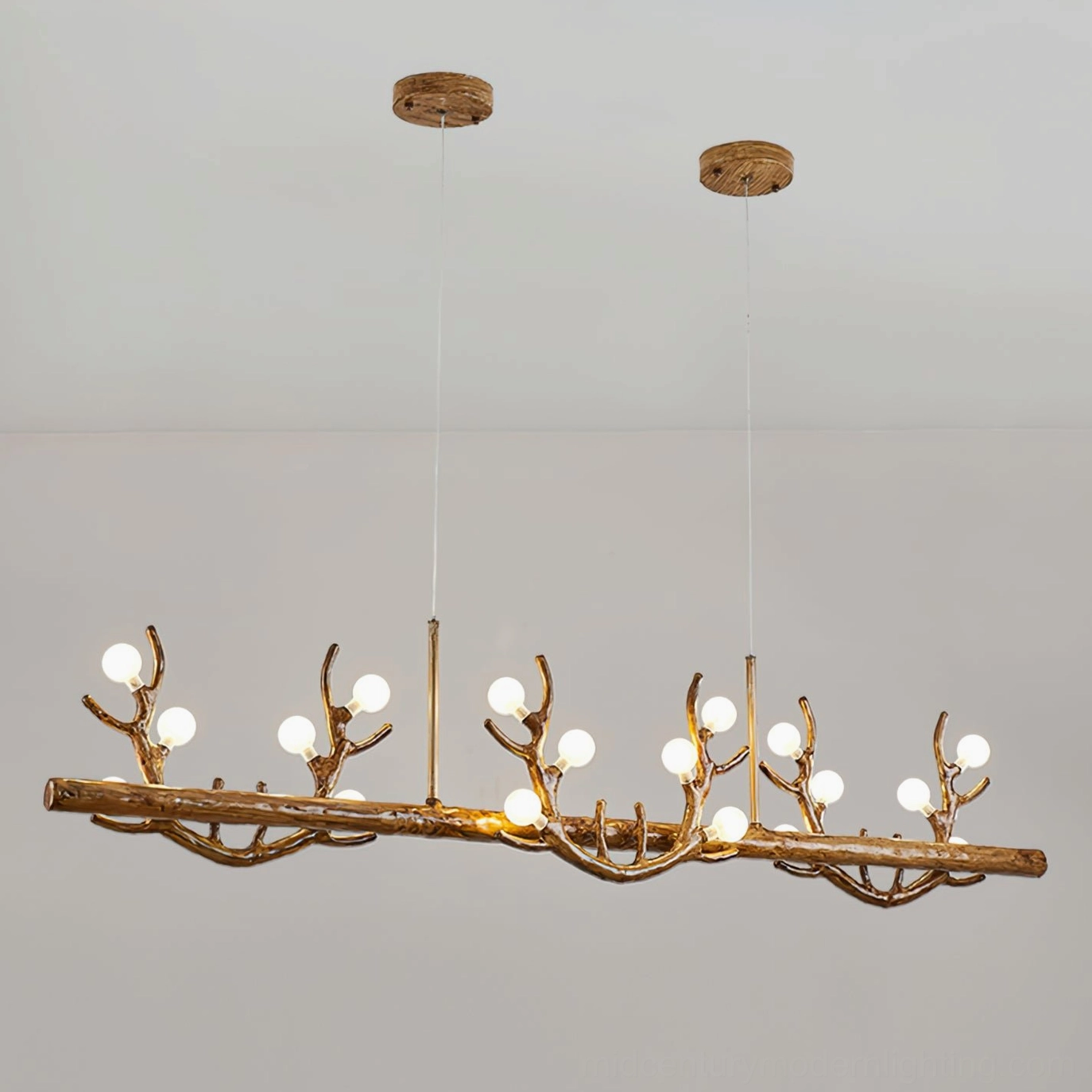Linear antler chandelier three-quarter front view showing wood grain texture and warm Edison-style bulbs against neutral backdrop