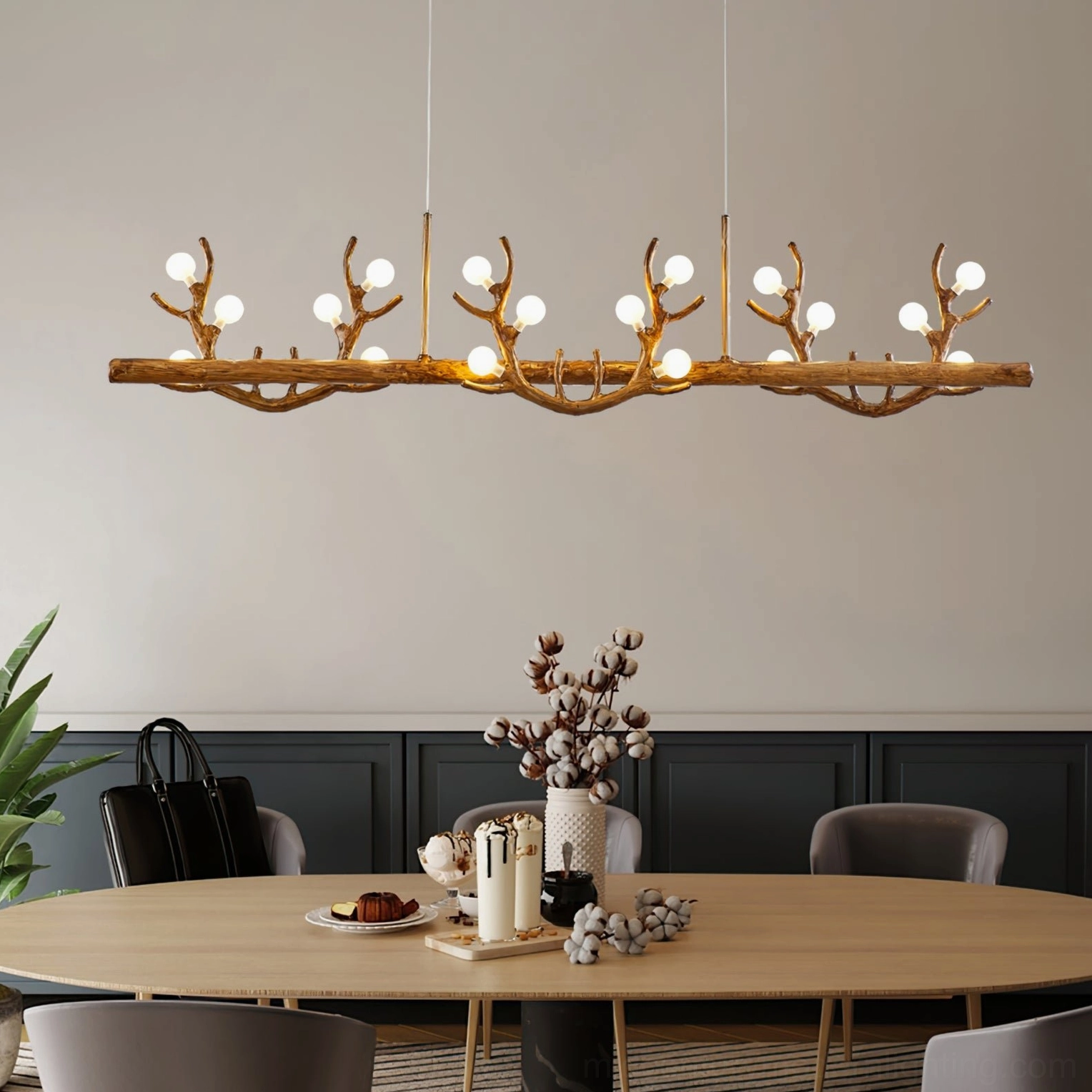 Antler branch chandelier side view in modern dark wood dining room with warm rustic home lighting ambiance