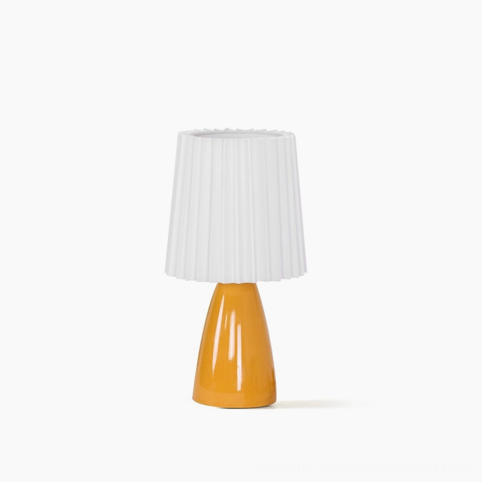 Apollo ceramic pleated fabric table lamp with orange base and white shade, flat front view