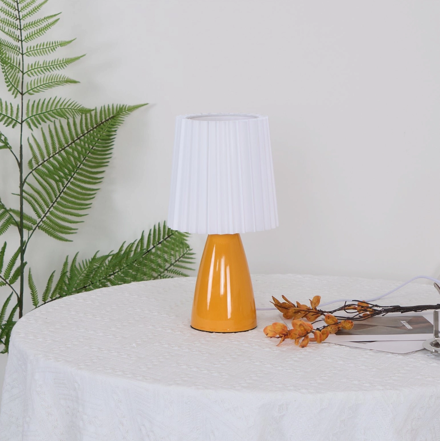 Apollo minimalist table lamp side view with dining table fern decor, unlit contemporary design