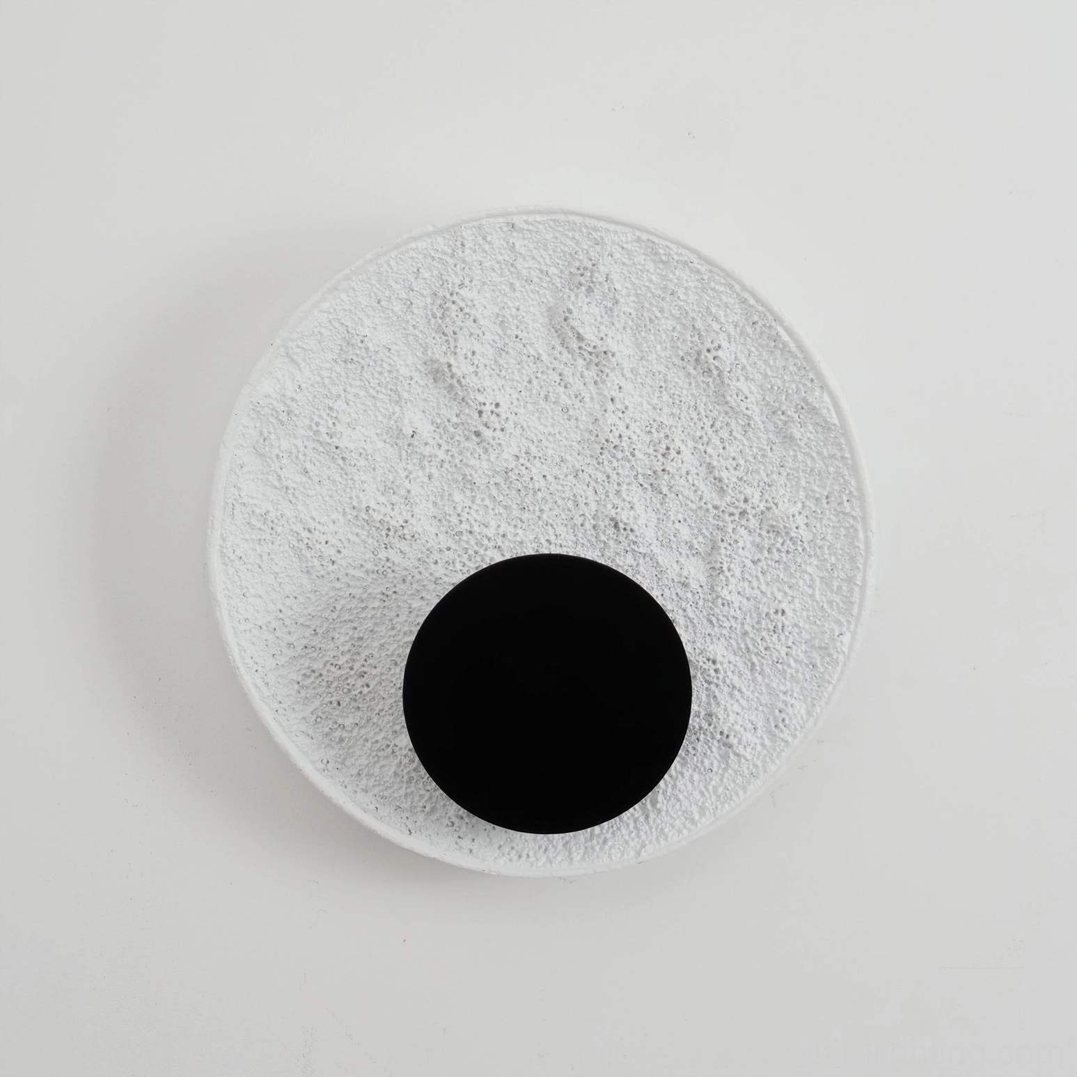 Apollo white textured moon wall lamp unlit flat front view minimalist design