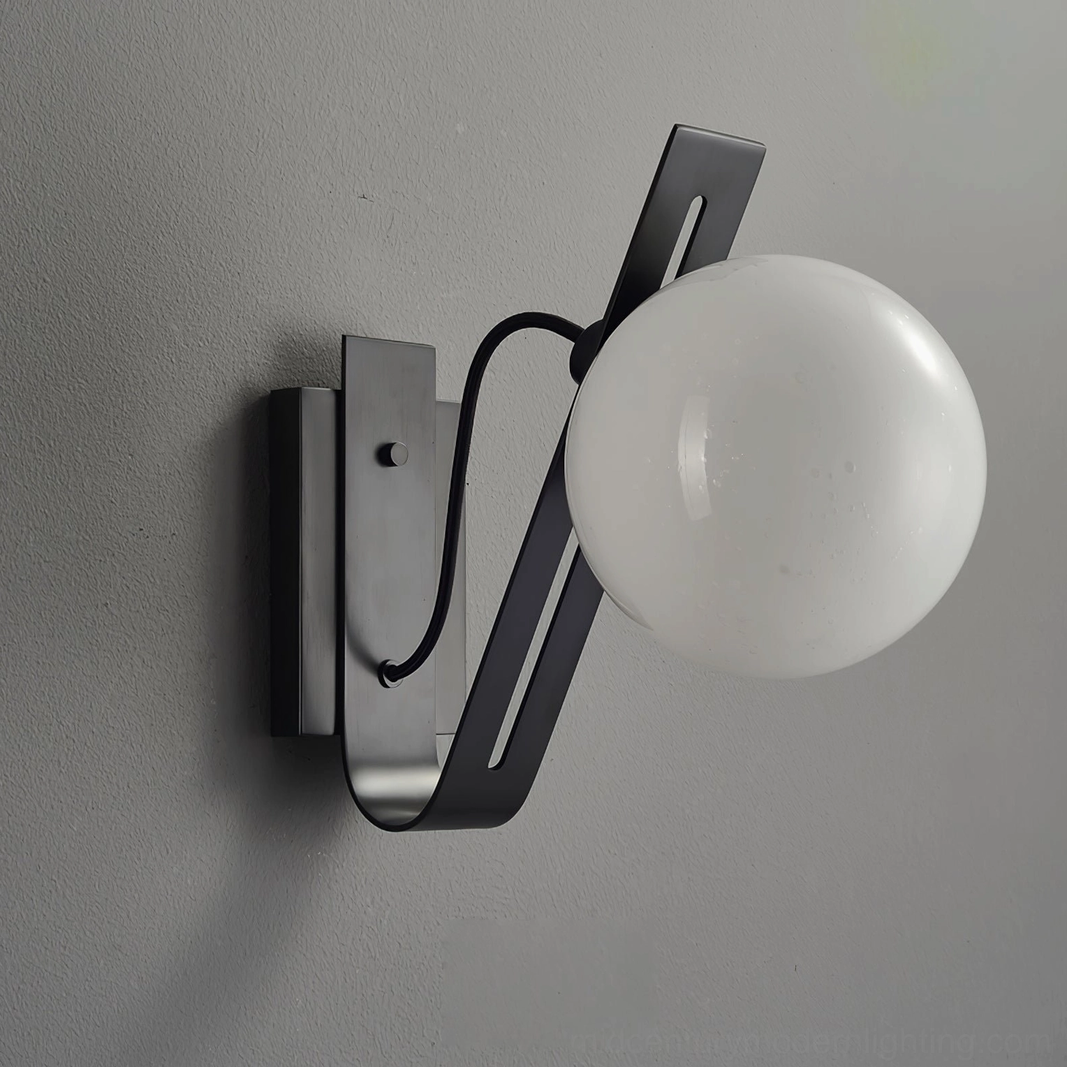 Black Arandela wall lamp side profile showing slotted metal bracket and curved power cord