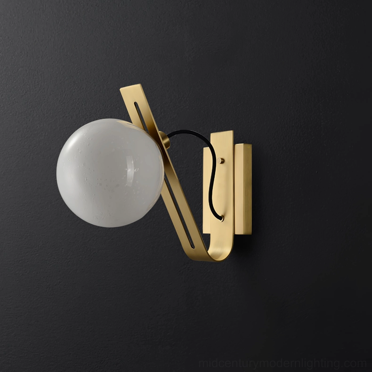 Burnished brass Arandela globe wall sconce in dark studio, contemporary minimalist luxury lighting