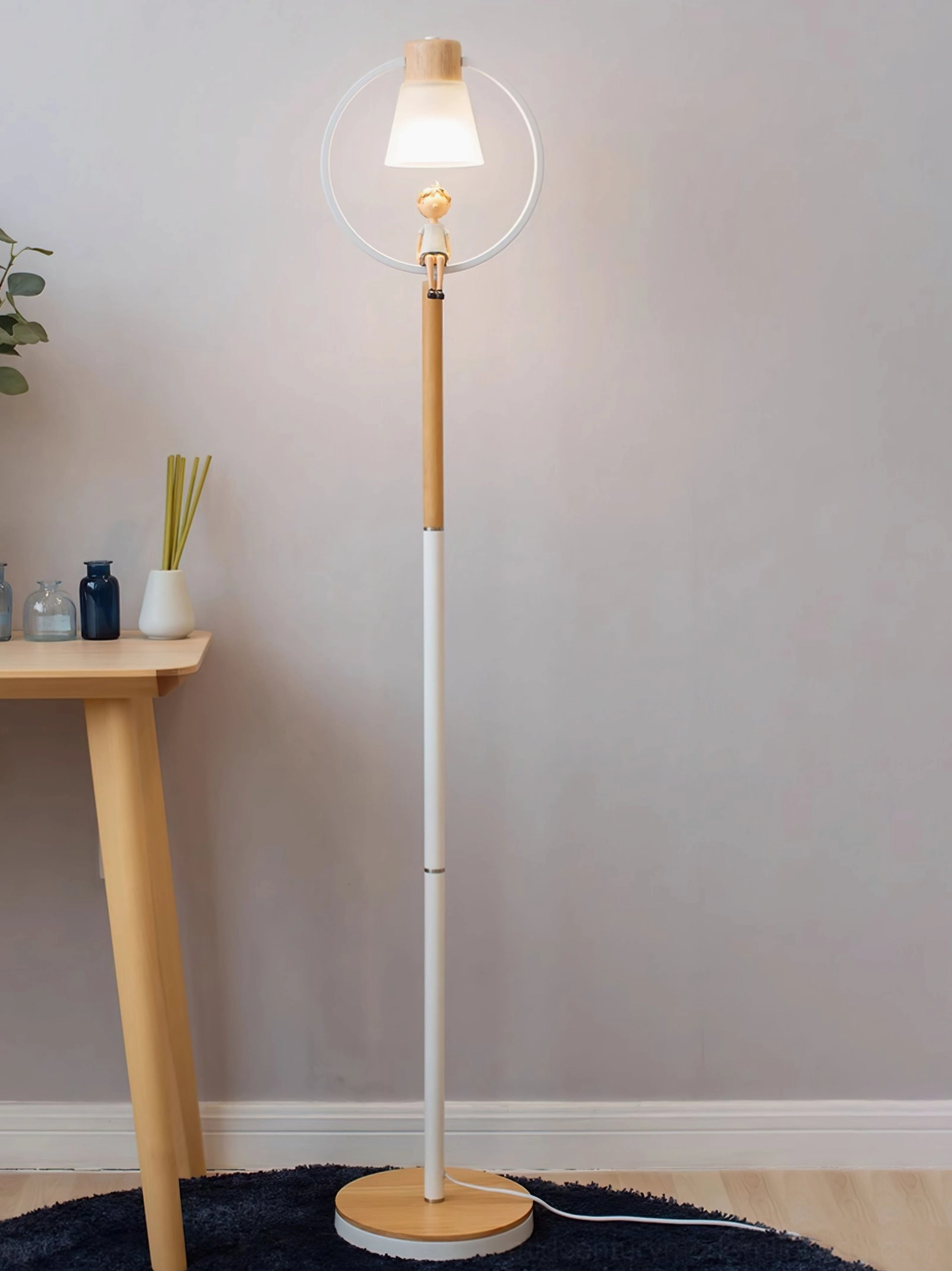 Mid-century modern arc floor lamp positioned beside wooden side table in minimalist Nordic interior
