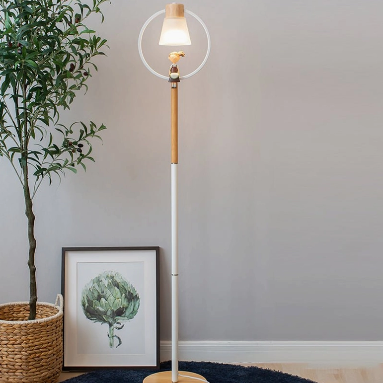 Contemporary arc floor lamp with woven basket plant in Scandinavian living room with framed art