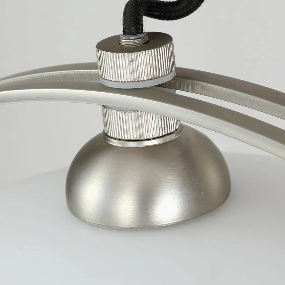 Arc pendant light in contemporary minimalist home setting demonstrating sculptural design and ambient illumination