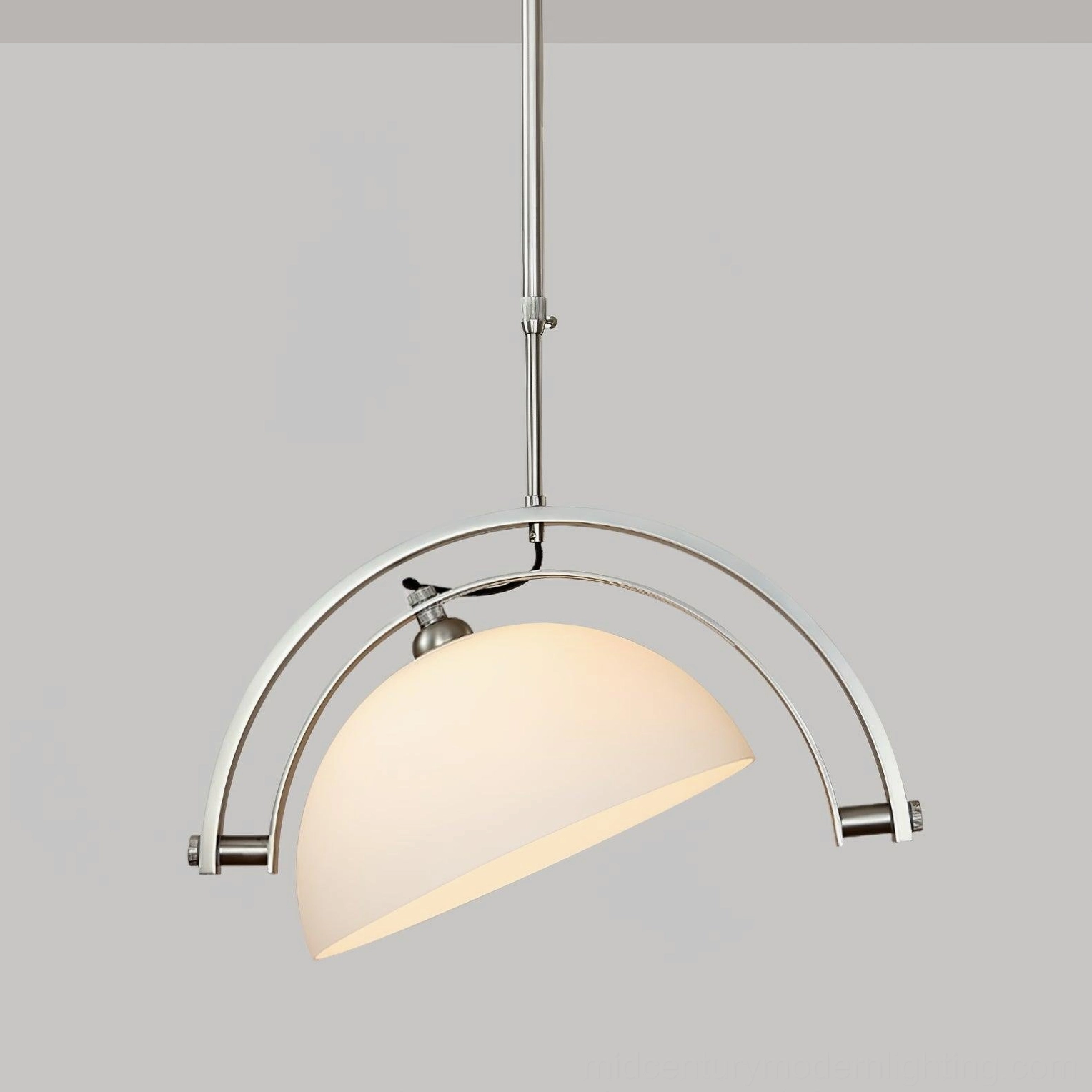 Arc pendant light from below showing illuminated matte white fabric shade and adjustable lighting angle design